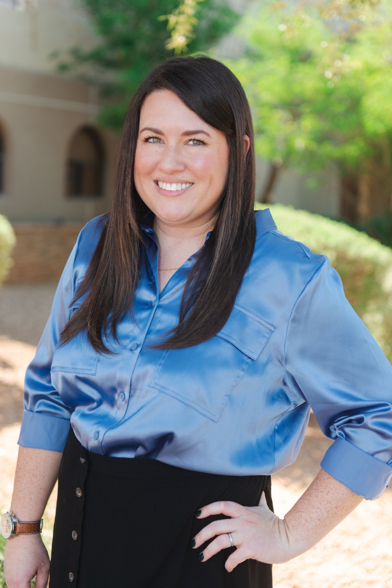 Therapist Shannon Worle standing outside in a blue sweater.